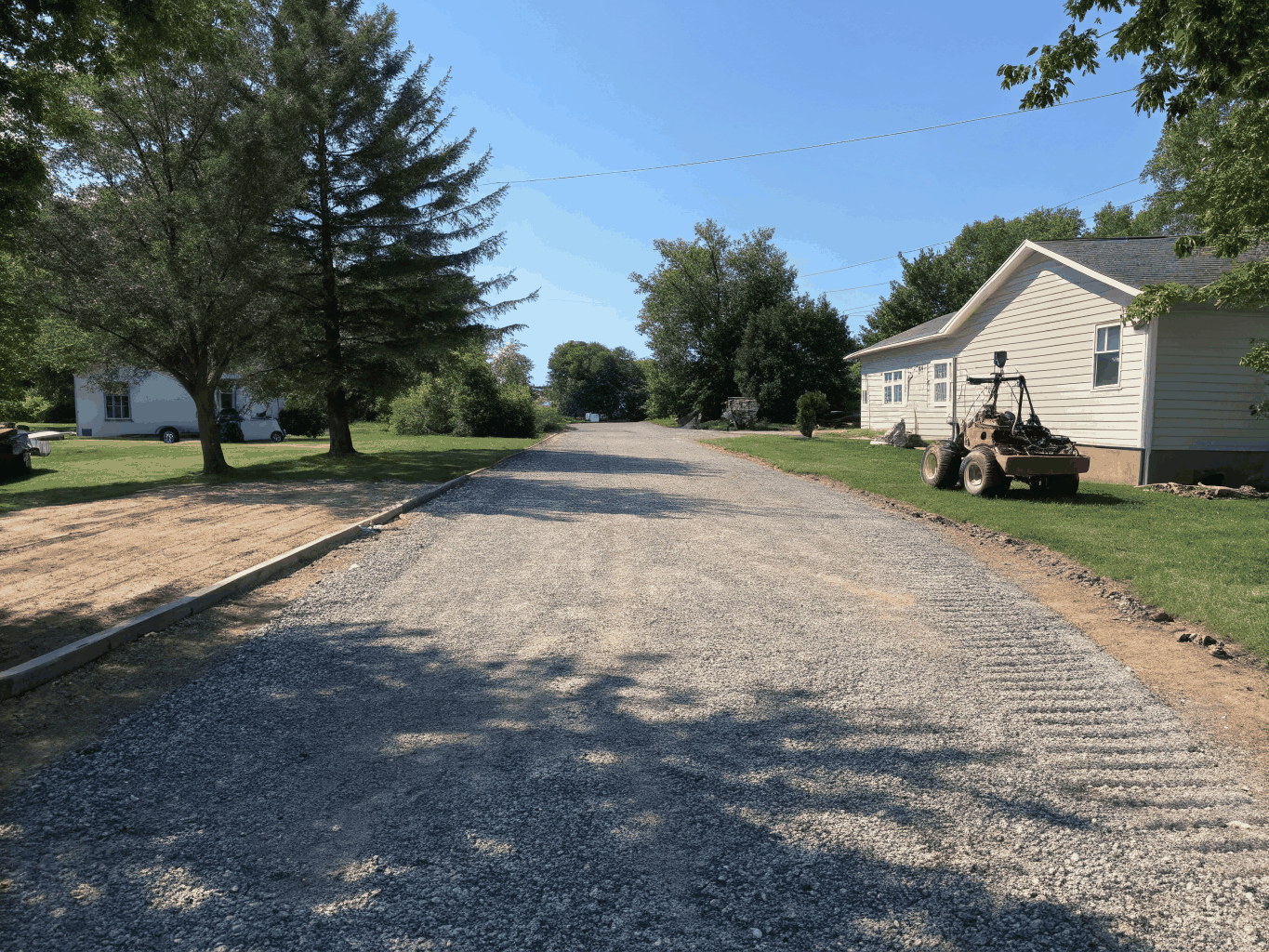 Freshly graded and compacted gravel driveway in Mebane